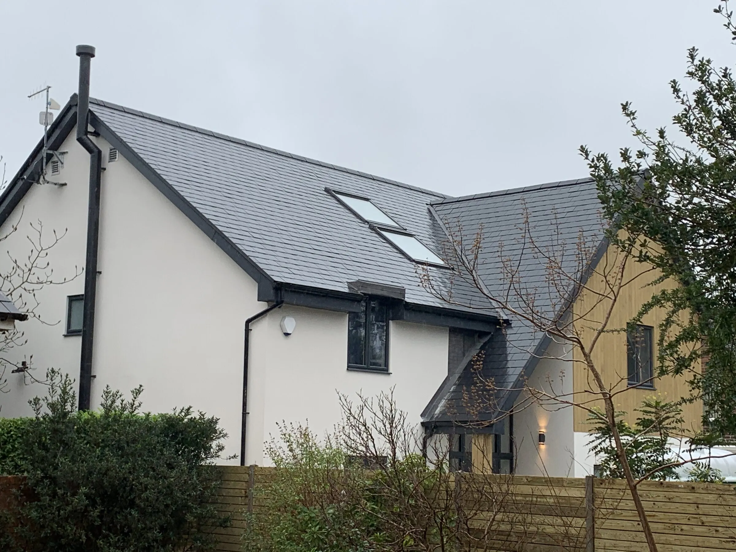 Detached house with a new natural slate roof