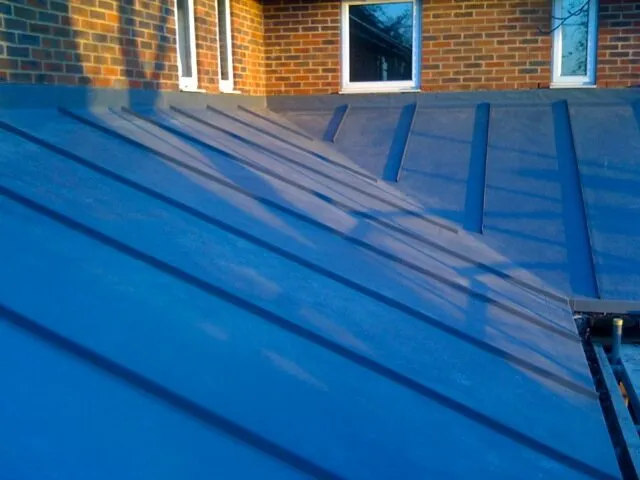 Blue single ply roof with raised standing seam profiles