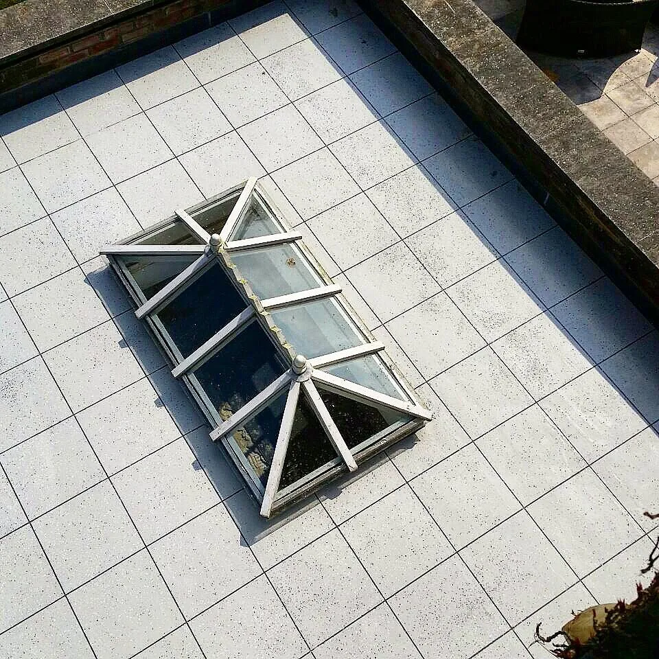 Tile-effect roof terrace finished around a lantern rooflight